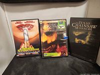 Front view of three DVD cases: Next Generation, 2003 remake, The Beginning
