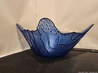 Side view showing textured exterior and curved rim