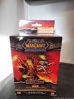 Front of Spoils of War booster box showing artwork and title