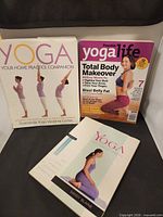 All three yoga books displayed upright