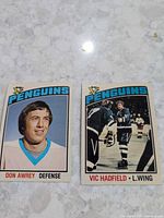 Front view of both cards showing player images and team branding