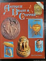 Front cover showing title, author and images of brass and copper items
