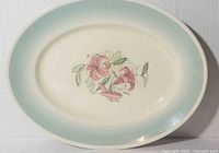 Front view of oval platter showing border and central floral design