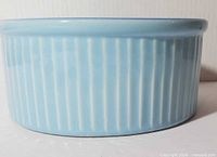 Side view showing ribbed exterior and glaze colour