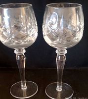 Two clear crystal wine goblets side by side