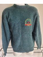 Front view of green wool Beaver Canoe sweater on mannequin