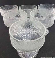 Front angled view of all six footed cups