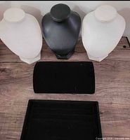 Five jewelry display pieces: three necklace busts, bracelet roll, ring tray