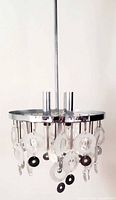 Full view of chrome and glass disc chandelier suspended from downrod