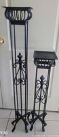 Both wrought iron candle holders full view