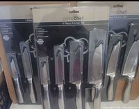 Front view showing three sealed Prime Chef 4 Piece Kitchen Sets