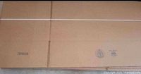 Bundle of flat Uline cardboard boxes