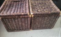 Front view of both wicker baskets with lids closed