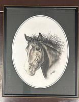 Framed oval-matted pastel charcoal portrait of horse in black frame