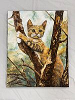 Full view of acrylic painting of orange tabby cat in tree