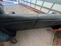 Rear view of black bonded leather sofa