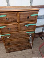 Front view showing all drawers and hardware
