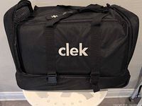 Front view showing Clek logo and buckle straps