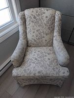 Front view of upholstered floral love seat