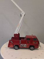 Left side view showing overall truck, boom extended