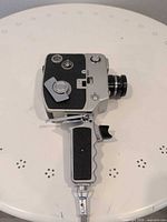 Left profile of Argus Super 8 camera showing controls and pistol grip