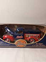 Boxed 1940 Ford Pepsi Cola die-cast bank visible through window