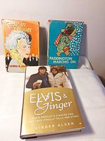 Front view of all three novels showing covers