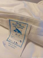 Label showing brand, material, size info