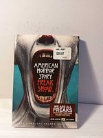 Front cover of DVD box set showing title, artwork, Walmart price sticker