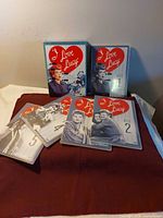 All discs and slipcase displayed on cloth