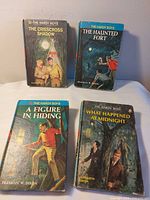 All four Hardy Boys books front covers visible