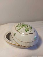 Covered dish with lid ajar showing interior