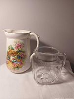 Both pitchers side by side showing size difference and designs