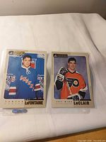 Both 5x7 cards in sleeves side by side