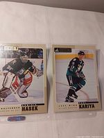 Both 1997 Pinnacle Beehive 5x7 cards in binder sleeve