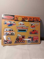 Front view of Melissa & Doug Sound Puzzle showing all eight vehicle pieces