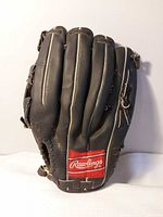Back of glove showing red Rawlings patch, leather condition and lacing