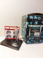 Front view of figure, backdrop and box