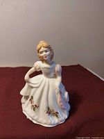 Front view of Royal Doulton December figurine