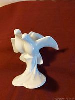 Front view of two-dove porcelain figurine
