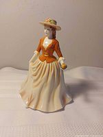 Front angled view of Royal Doulton Autumn Stroll figurine