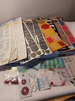 Overview of all sealed scrapbook embellishment packs laid out
