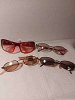 All four pairs of sunglasses laid out