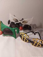 Group shot of all four novelty sunglasses