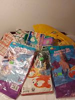 Overall lot showing packaged inflatables, kickboard, snorkel set and hat