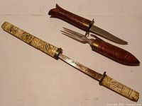 All pieces: knife, fork, sheath, tanto with scabbard