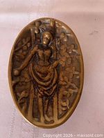 Obverse side with relief of woman on ladder