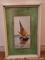 Front view of framed watercolour with green mat and white frame