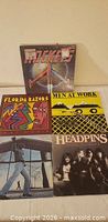 Front covers of five LPs including Rockets, Florida Razors, Men at Work, Headpins