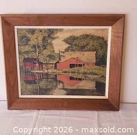 Front view of framed lithograph showing artwork, mat, and full wood frame